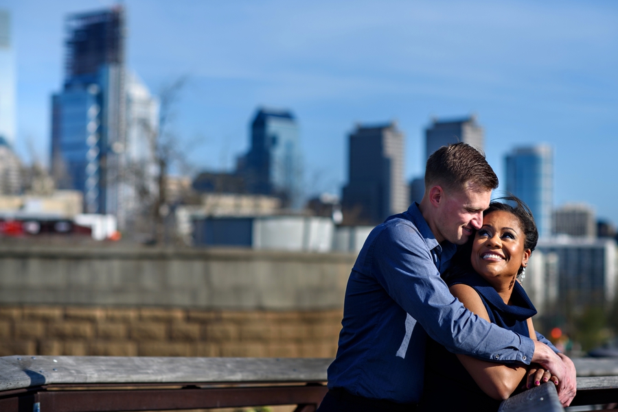 A couple in love in front of the Philly Skyline.